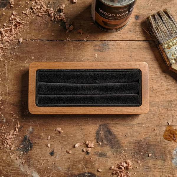 Rectangular wooden guitar pick display box made of walnut, featuring three rows of black velvet slots for organizing a pick collection.