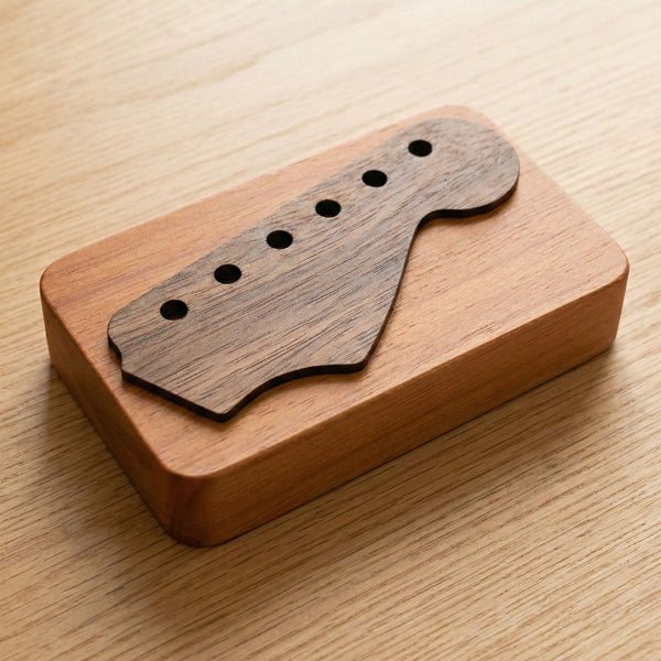 Custom wooden pick case with guitar headstock-shaped lid carved from customer's guitar photo
