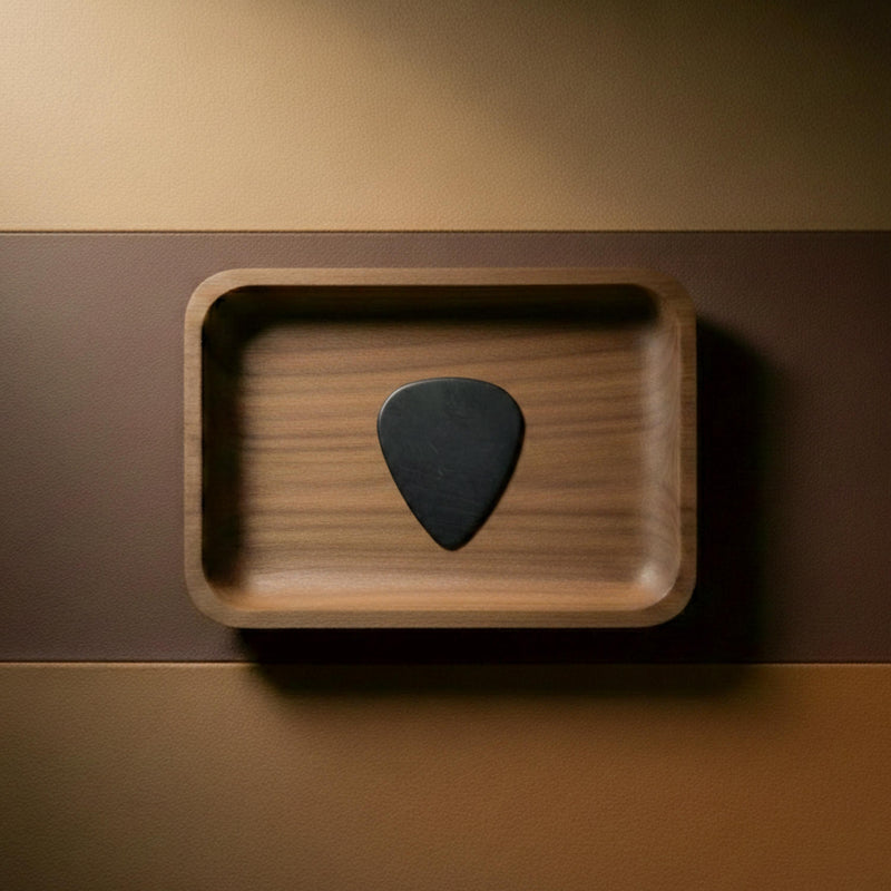 Durable black PEI material guitar pick with matte finish.