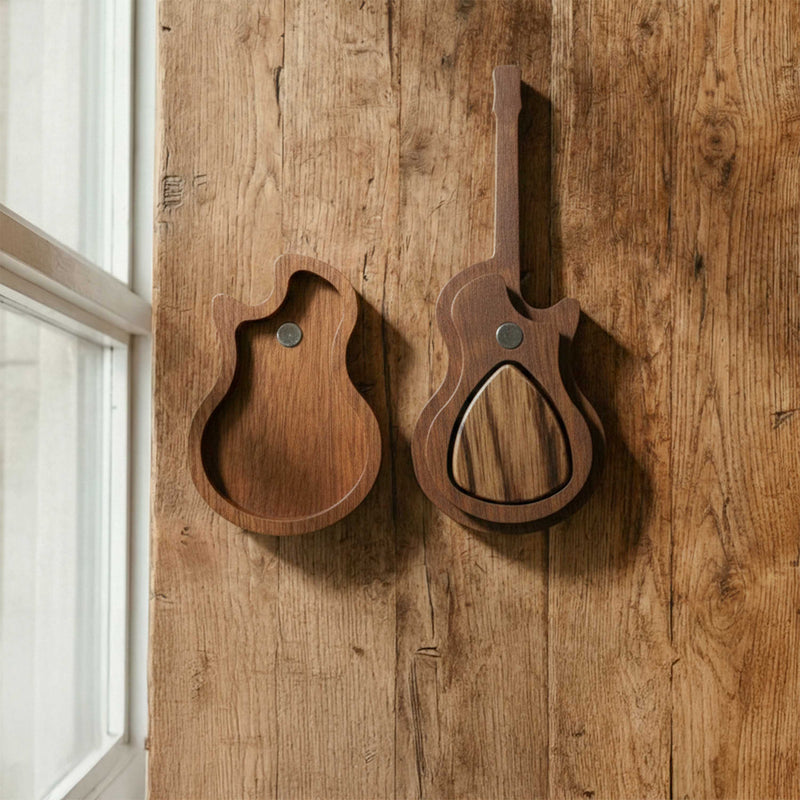 Guitar body shaped wooden pick holder with a swivel lid mechanism. Darker wood grain texture, displaying a compact pocket-size design for musicians.