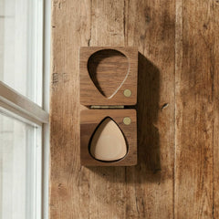 Square wooden guitar pick case with rounded corners and a brass hinge. Minimalist design open to reveal a pick slot, suitable for personalized engraving.
